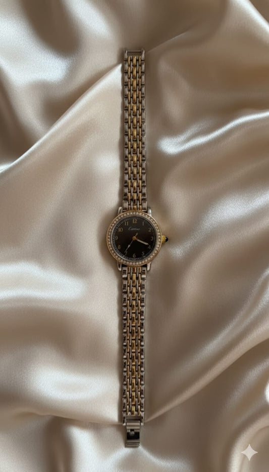 Montre Cartier bicolore avec cadran noir et strass